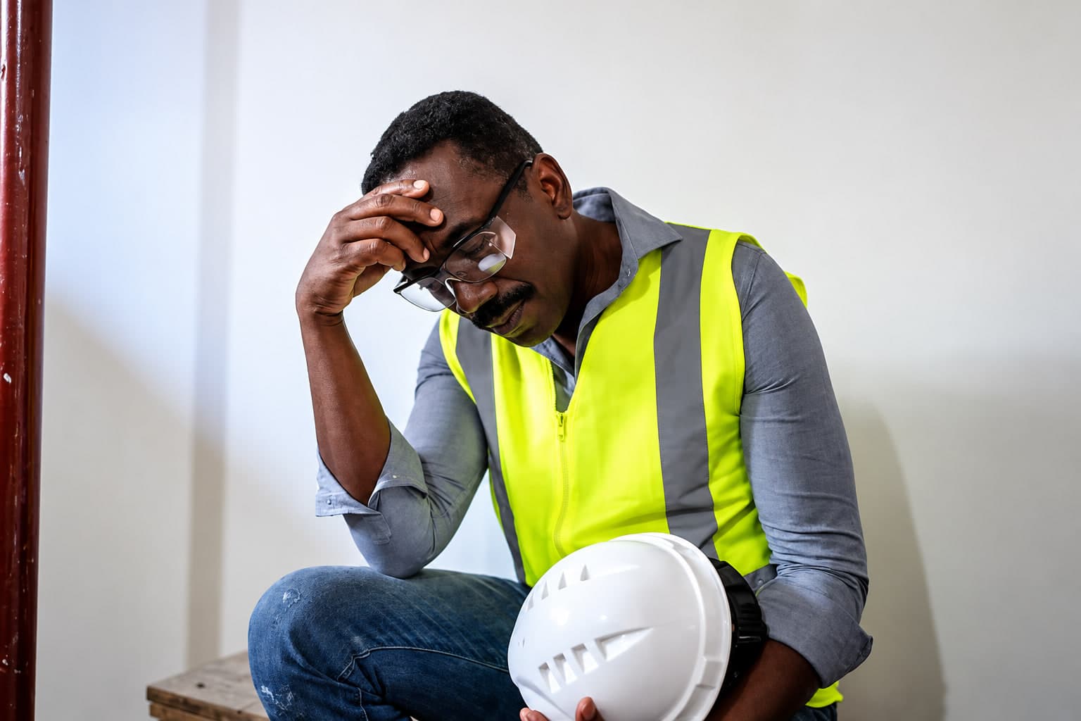 Stressed Worker with Safety Helmet
