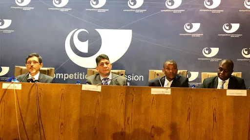 From left: Minister of trade and industry Ibrahim Patel, Vodacom Group CEO Shameel Joosub, commissioner of the Competition Commission Tembinkosi Bonakele, and deputy commissioner of the Competition Commission Hardin Ratshisusu.